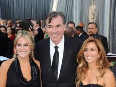 Casey Beane is standing on the right of Billy Bean, and Tara Beane at the left, as they are wearing all black.